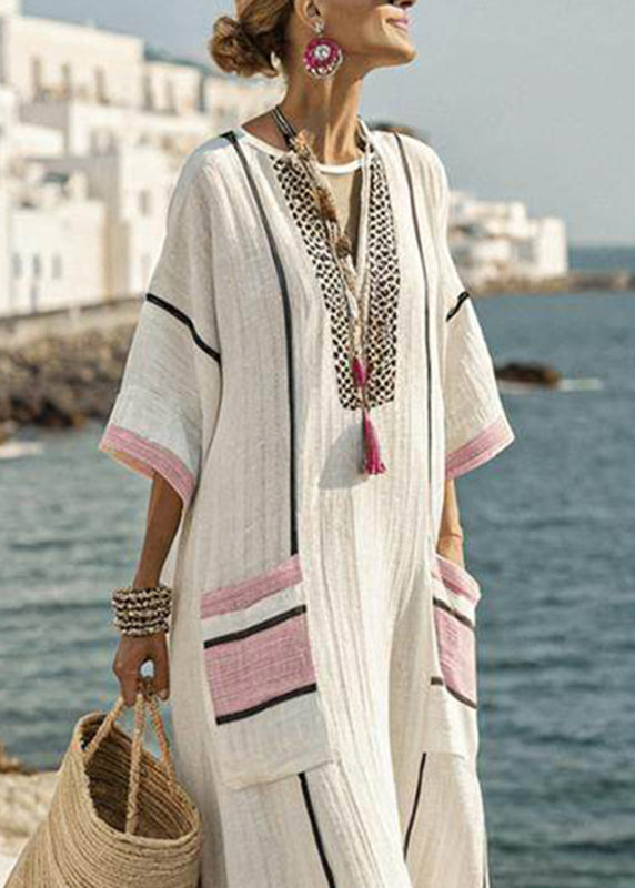 Flowy short sleeve plus size maxi dress for women, featuring a vibrant striped patchwork pattern, summer.