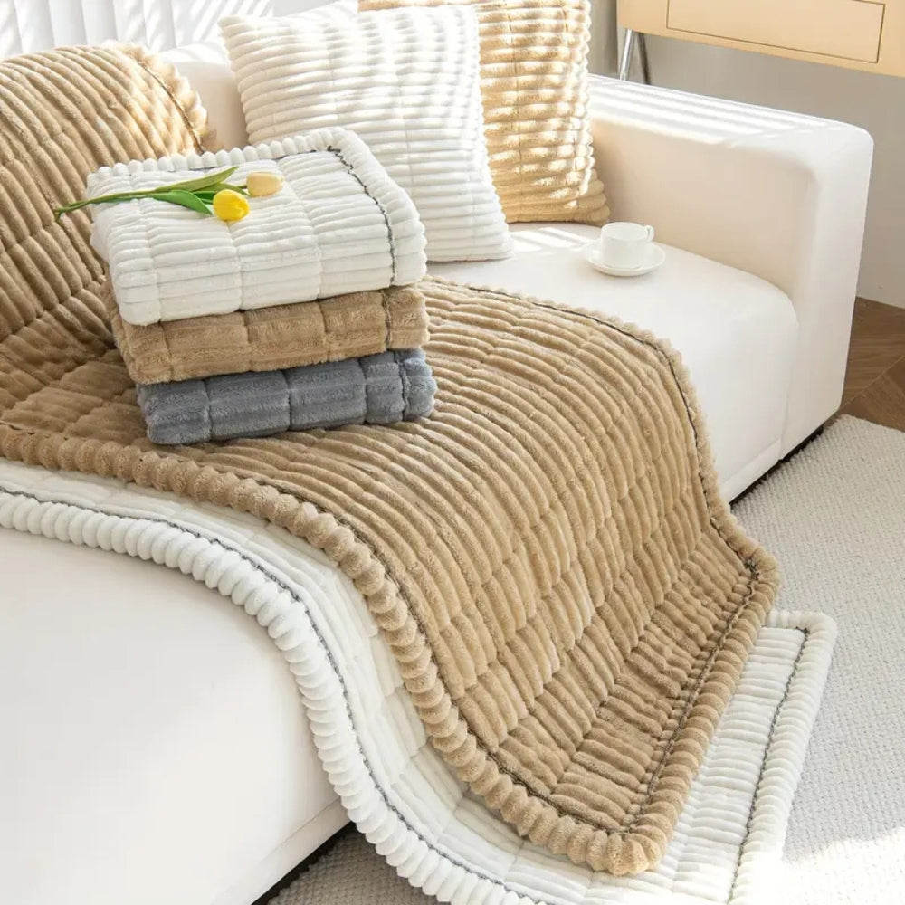Quilted plush fleece sofa protector mat. Non-slip design for secure, comfortable furniture cover in any home decor.