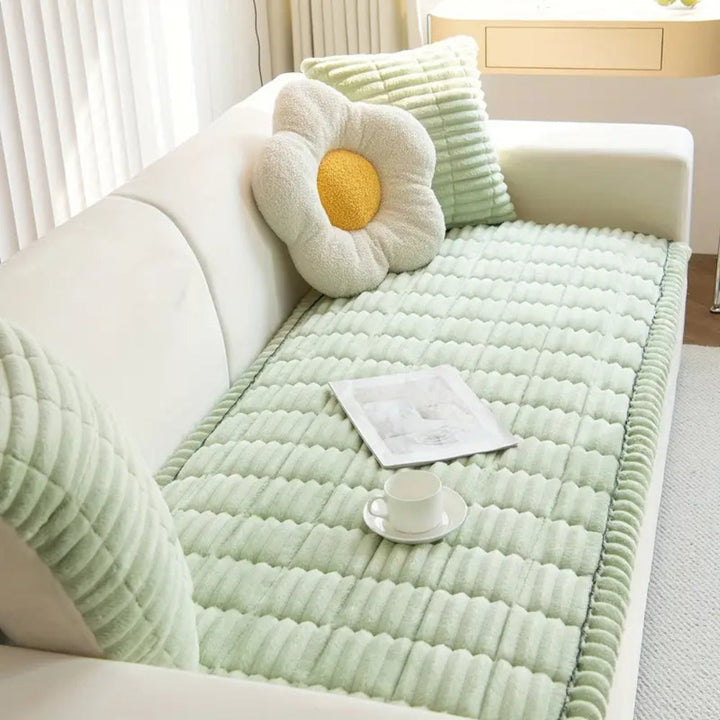 Plush fleece sofa protector mat, non-slip backing, quilted design for comfortable furniture protection.