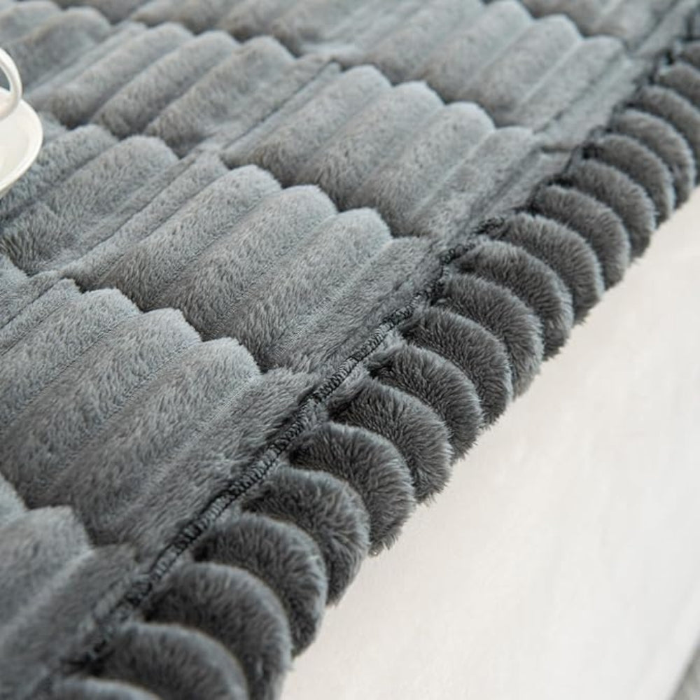 Heavy-duty plush fleece sofa protector mat. Non-slip quilted cover ensures durable, long-lasting furniture protection.