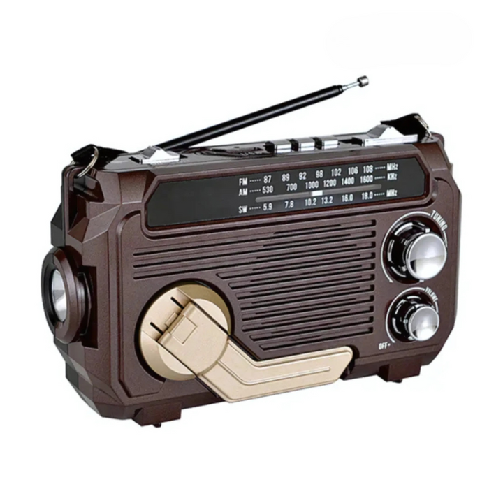 Outdoor emergency radio with solar panel, hand-crank dynamo, flashlight, and power bank for survival.