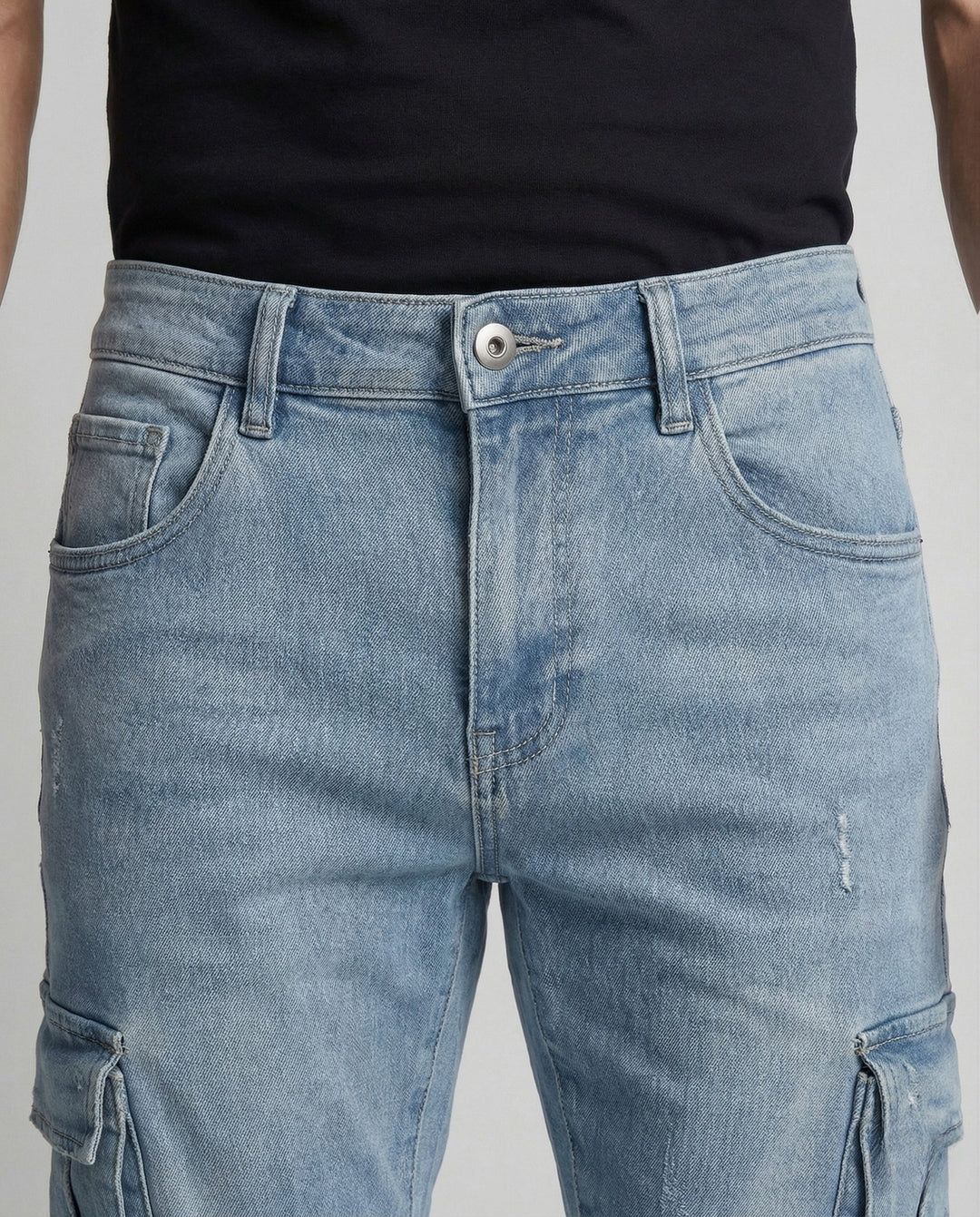Stylish men's slim fit denim cargo pants, designed with multiple sewn pockets for a trendy look.