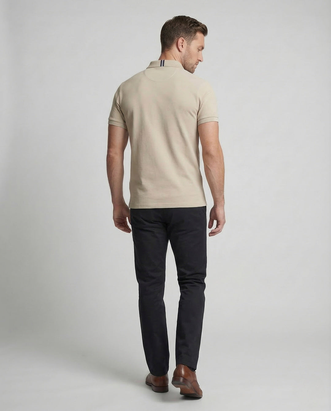 Black men's classic short sleeve polo shirt, featuring a subtle embroidered chest emblem. Versatile wardrobe staple.