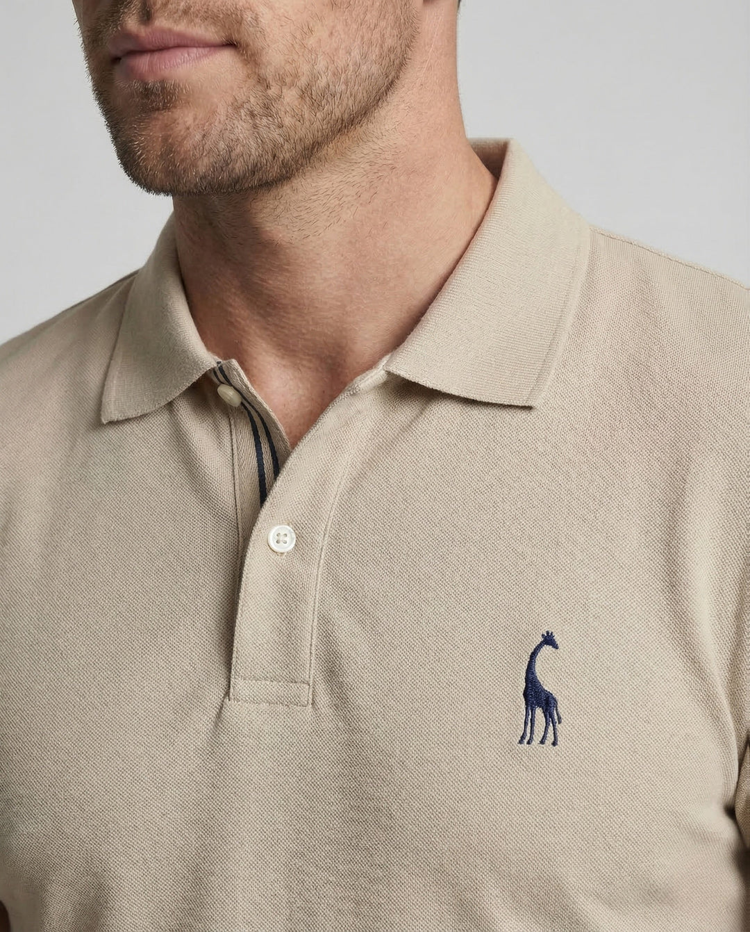 Slim fit men's white short sleeve polo shirt, ideal for smart casual outfits. Versatile and classic style.