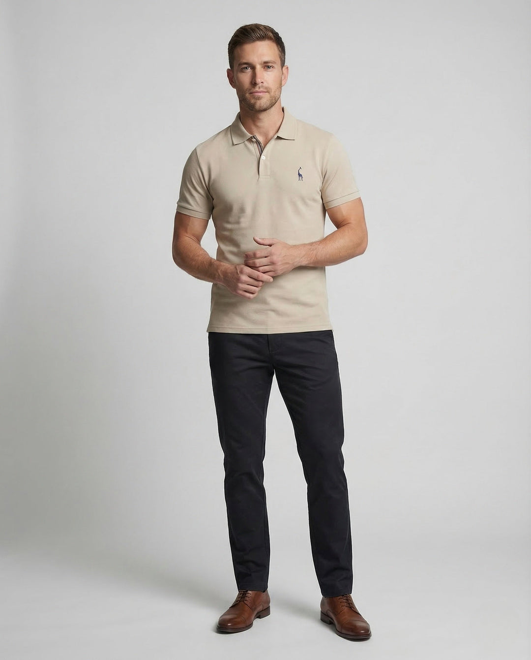 Men's classic navy short sleeve polo shirt with embroidered chest emblem. Perfect for smart casual wear.