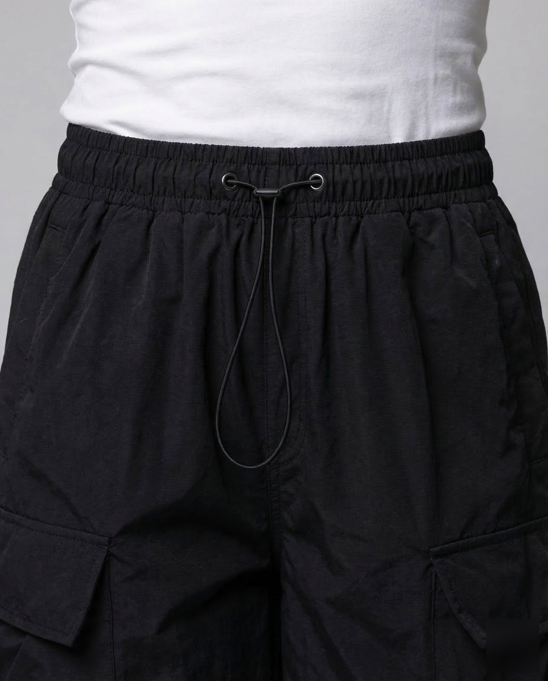Stylish women's oversized cargo pants with multiple utility pockets and an adjustable waist for comfort.