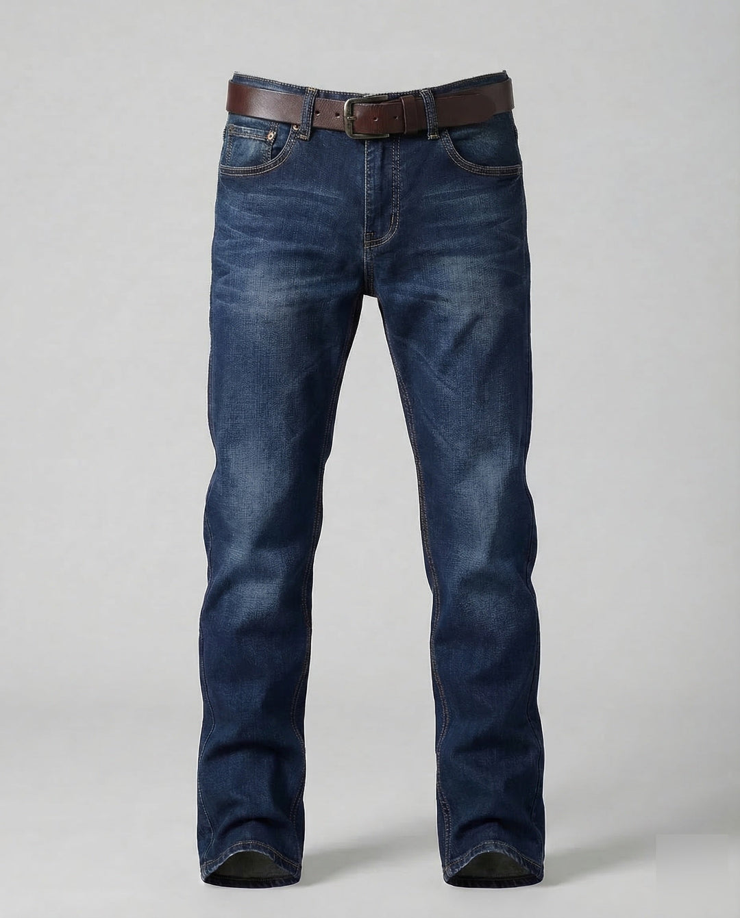 Man posing in modern slim fit stretch jeans, showcasing comfortable urban style and flexibility.