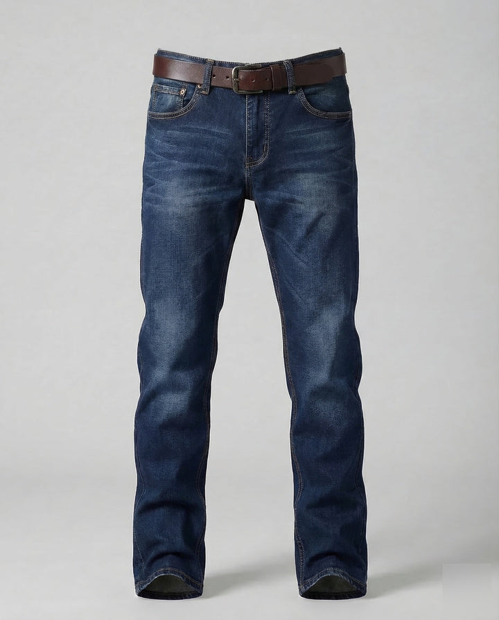 Man posing in modern slim fit stretch jeans, showcasing comfortable urban style and flexibility.