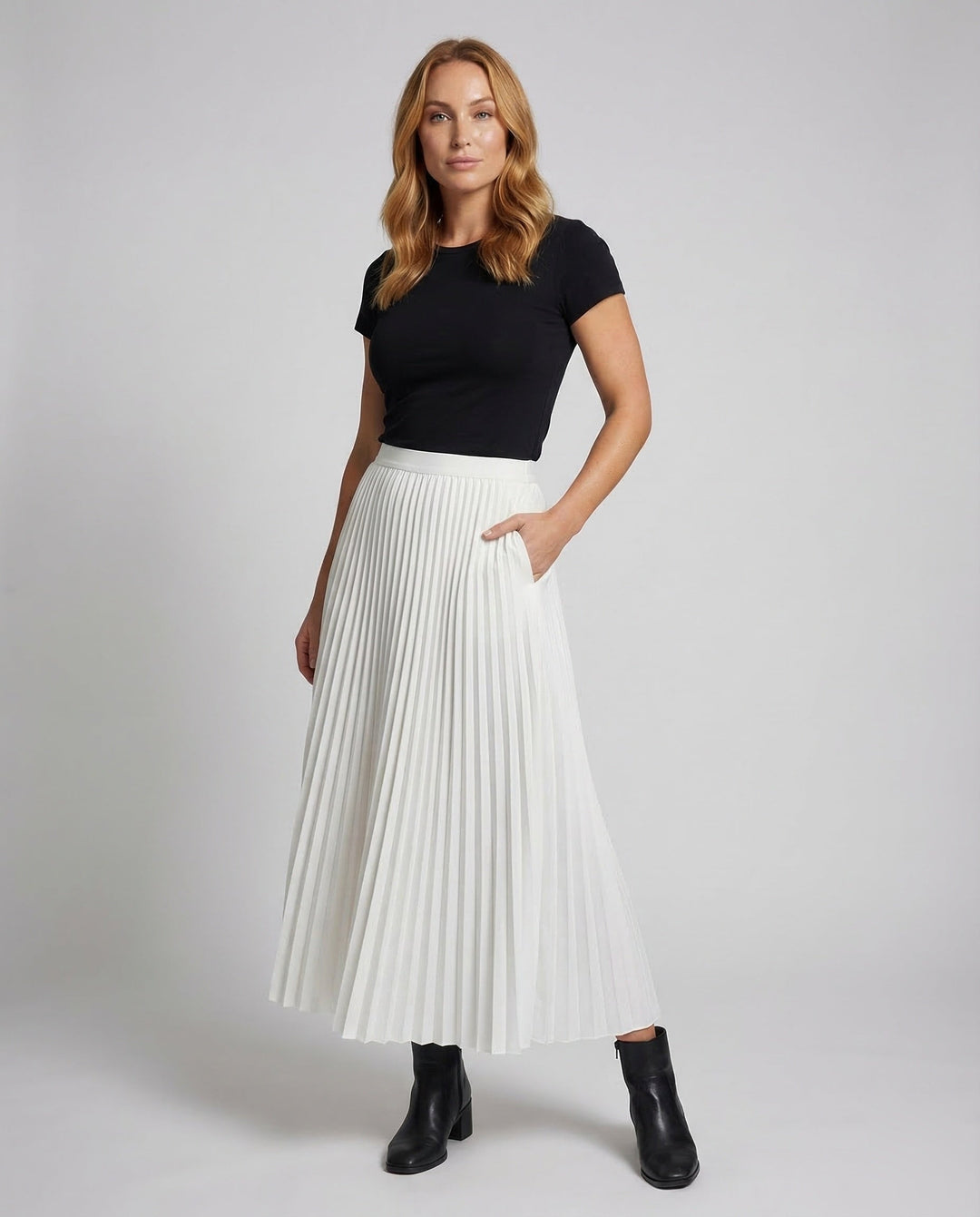 Women's elegant pleated midi skirt, perfect for versatile office & casual spring/summer fashion.