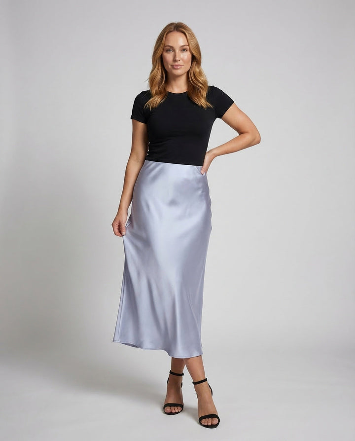 Elegant black flowy high-waist midi skirt for women, perfect for versatile fashion and summer style.