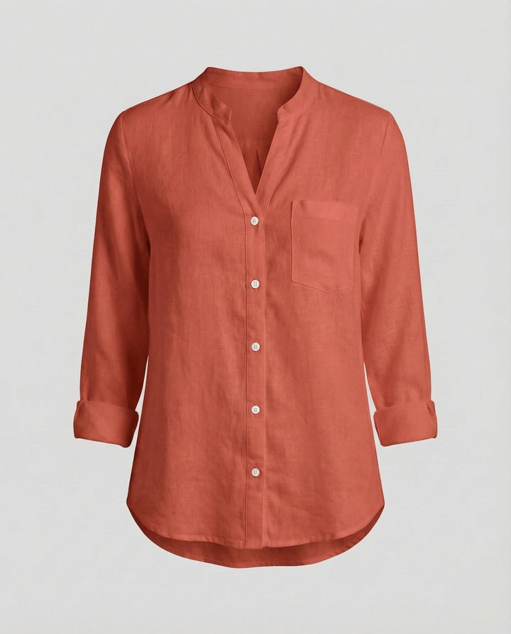 Front view of a women's relaxed fit stand collar shirt. Long sleeve button-up with chest pocket, perfect for any occasion.
