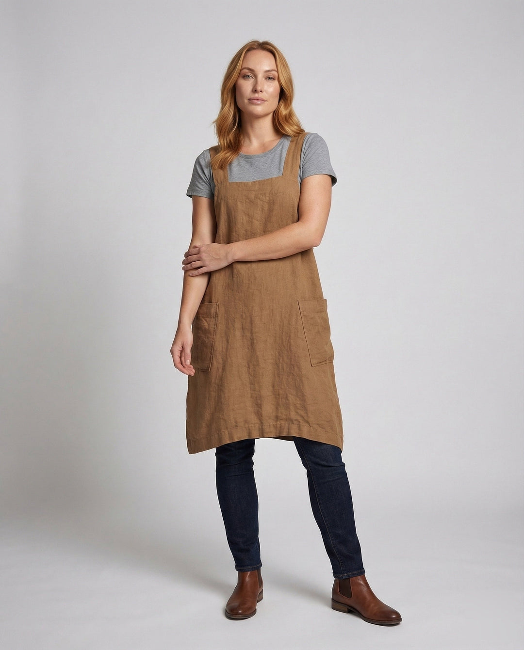 Women's relaxed fit square neck overall midi dress in a casual summer style with practical pockets.