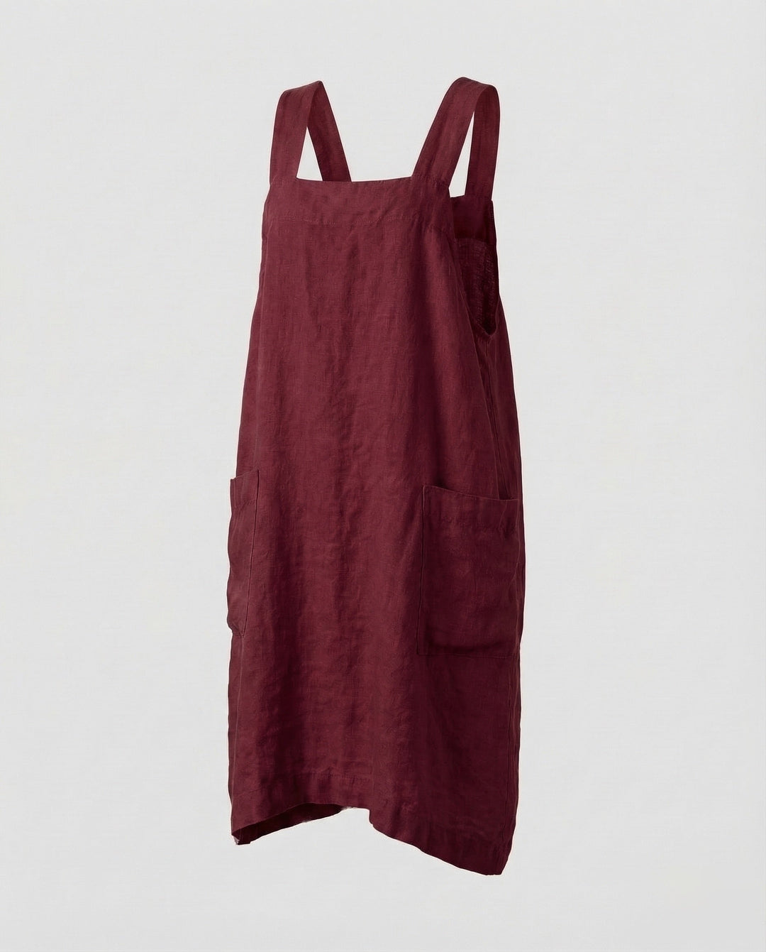Stylish women's dungaree midi dress with a square neckline, loose fit, and convenient front pockets.