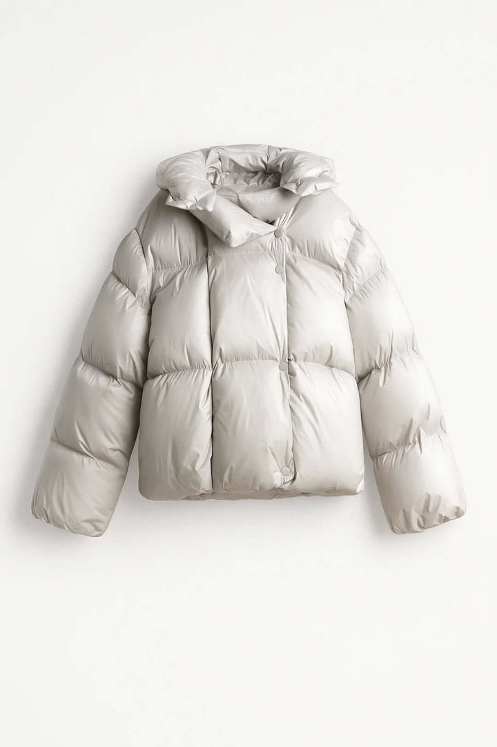 Women's voluminous puffer jacket, warm & modern winter style outerwear with snap closure for cold weather.