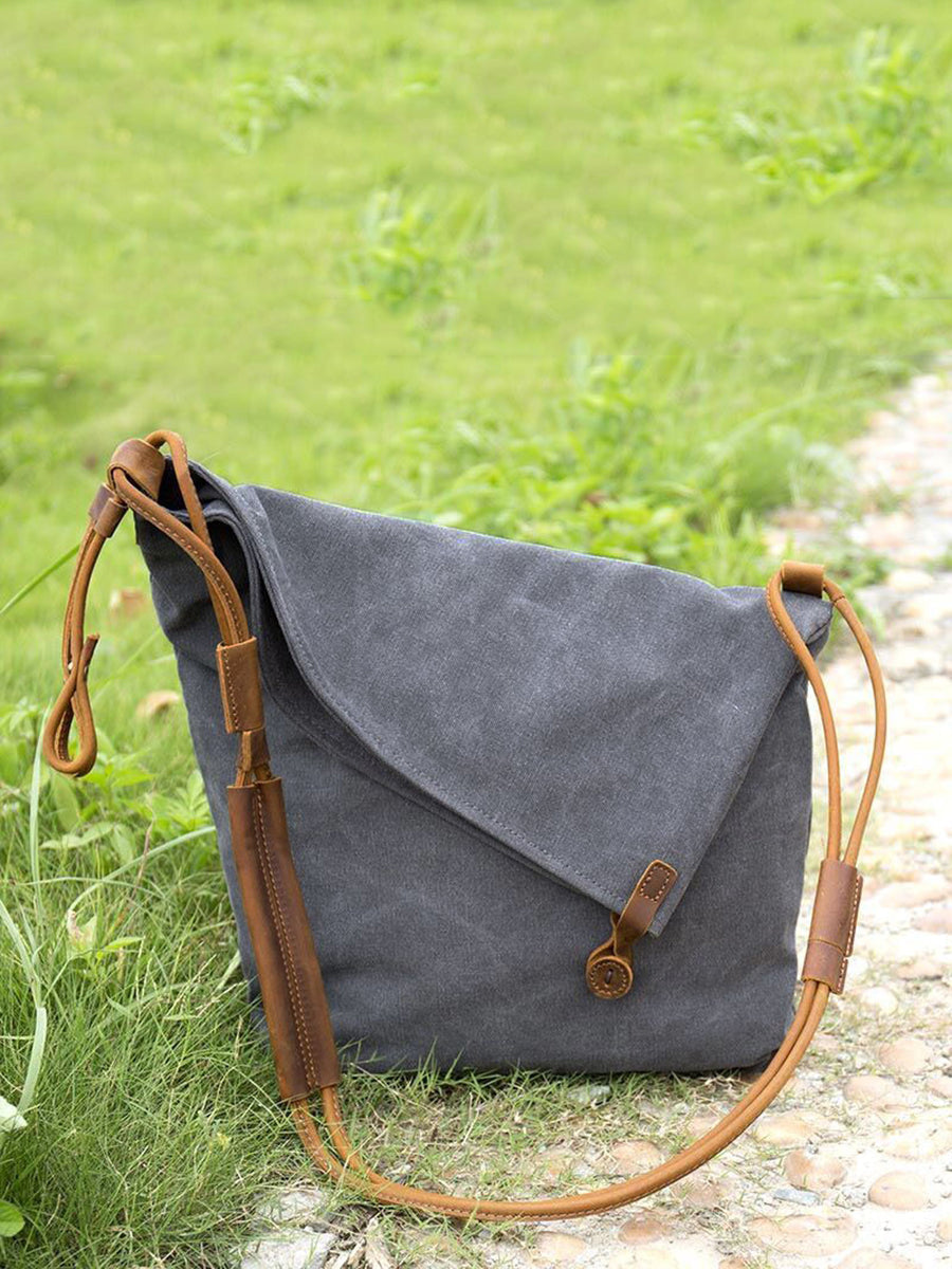 Trendy women's shoulder bag featuring a unique asymmetrical folded design, perfect for casual.