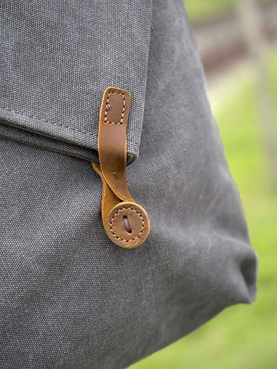 Practical women's casual shoulder bag, an asymmetrical slouchy style with easy button closure.