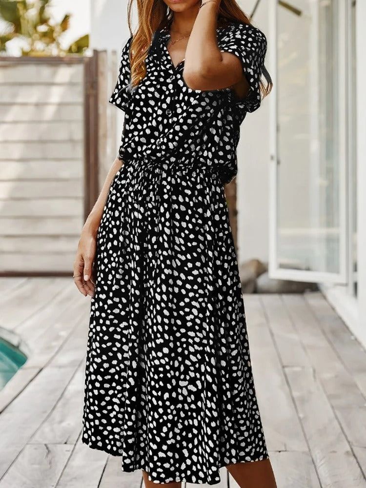 Women's flattering elegant midi dress, short-sleeve & lightweight for versatile summer styling.