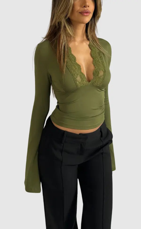 Elegant women's long-sleeve wrap top with delicate lace trim accentuating the deep V-neck.