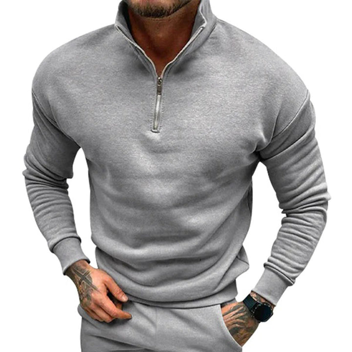Clean men's half zip knitwear, a minimalist pullover jumper for effortless winter style.