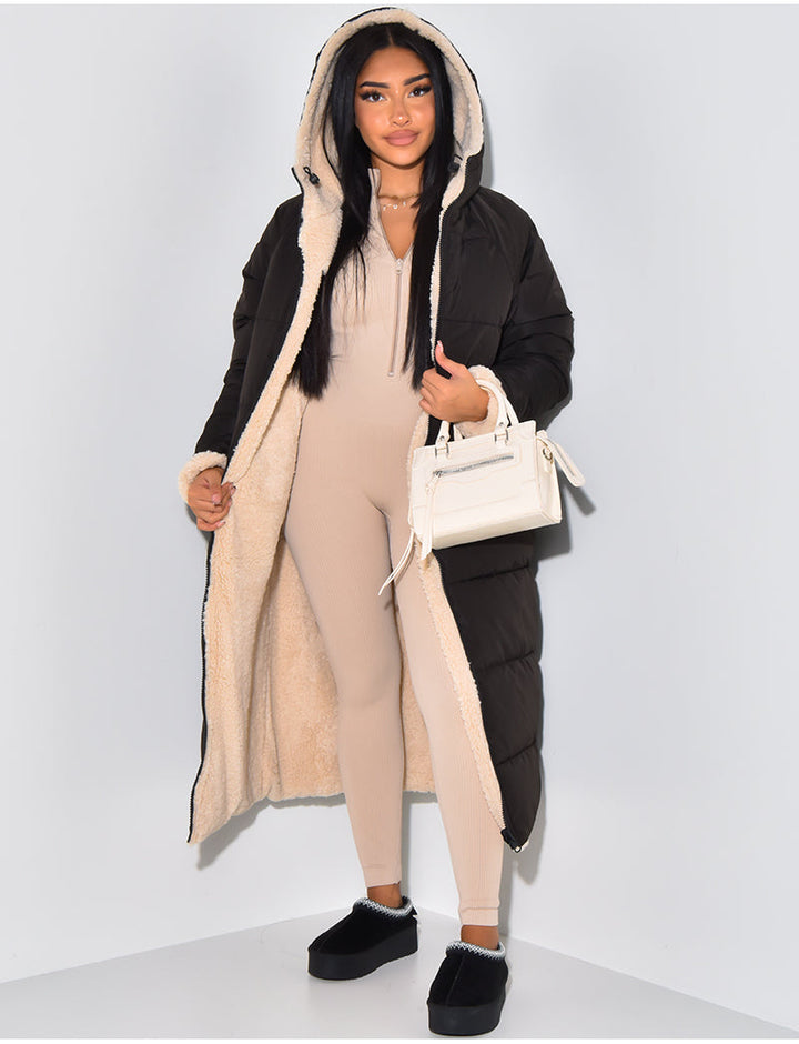 Women's reversible longline winter jacket for versatile cold weather style. Cozy and warm hooded outerwear.