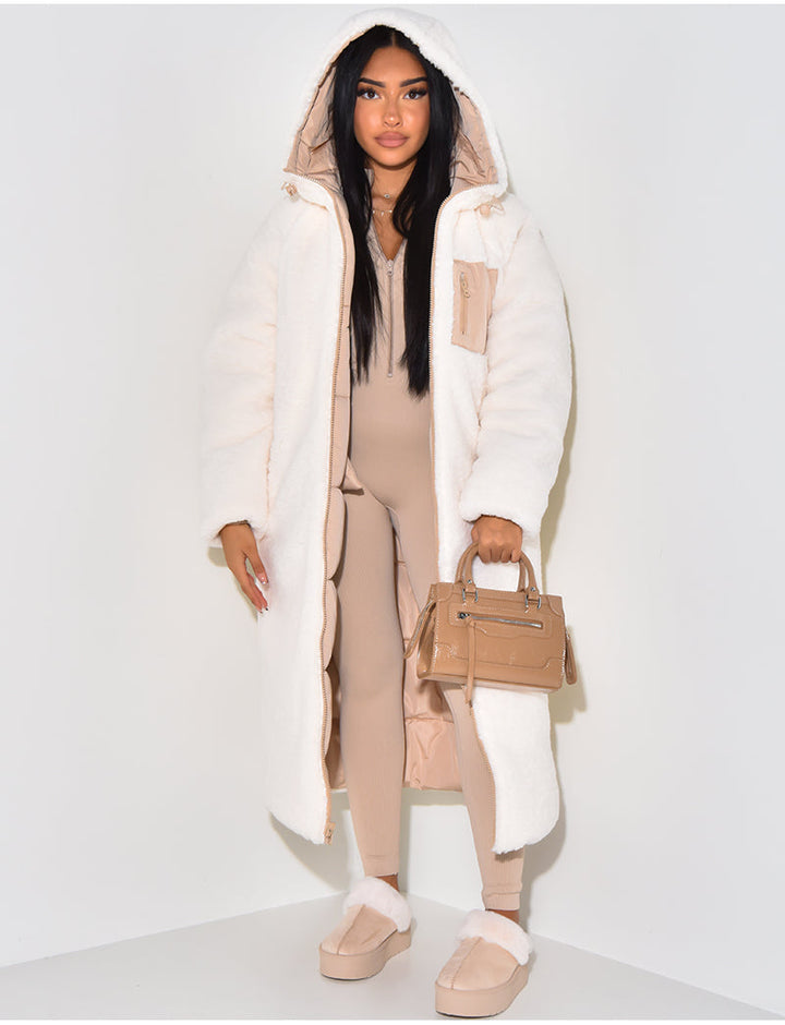 Warm women's reversible longline winter jacket. Quilted design, cozy and hooded for ultimate cold weather comfort.