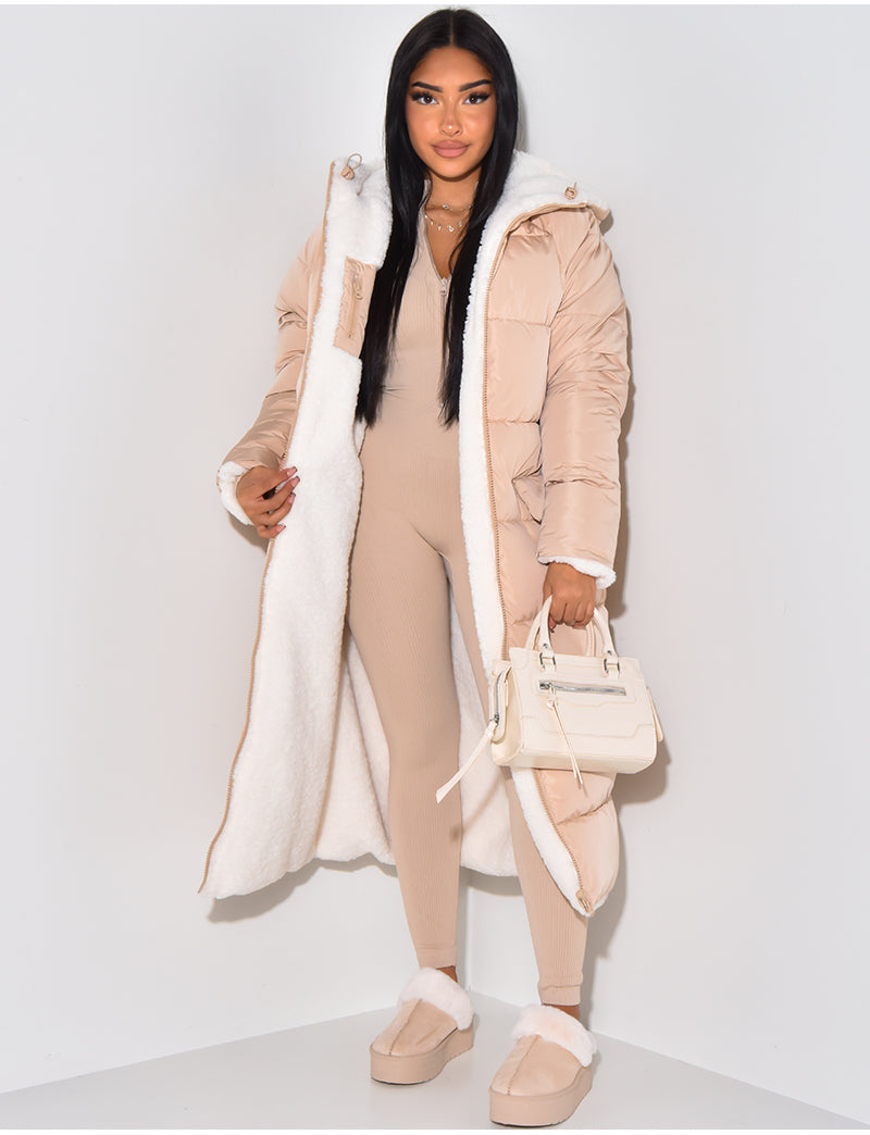 Women's longline reversible winter jacket, ideal for cold weather. Hooded outerwear offering versatile warm style.