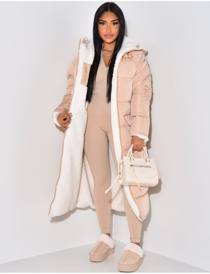 Women's longline reversible winter jacket, ideal for cold weather. Hooded outerwear offering versatile warm style.