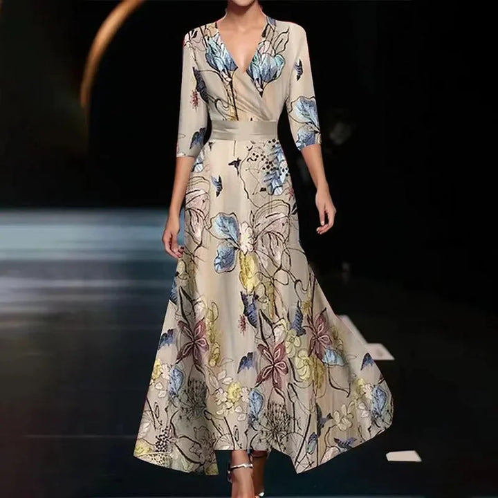 Stylish women's floral wrap maxi dress, featuring a cinched waist and flowy skirt for an elegant silhouette.