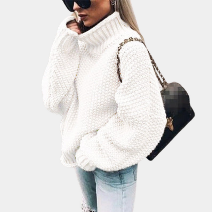 Women's cozy oversized turtleneck sweater in soft knit, perfect for stylish winter comfort & casual wear.