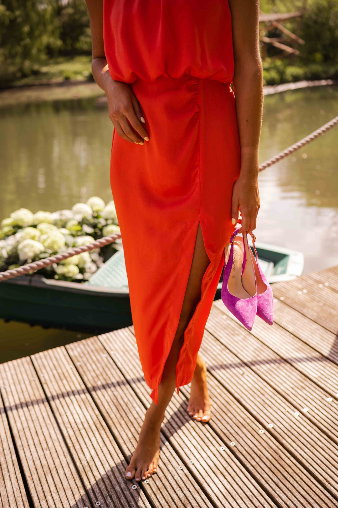 Sophisticated women's halter midi dress with a classy slit, perfect for elegant summer wear.
