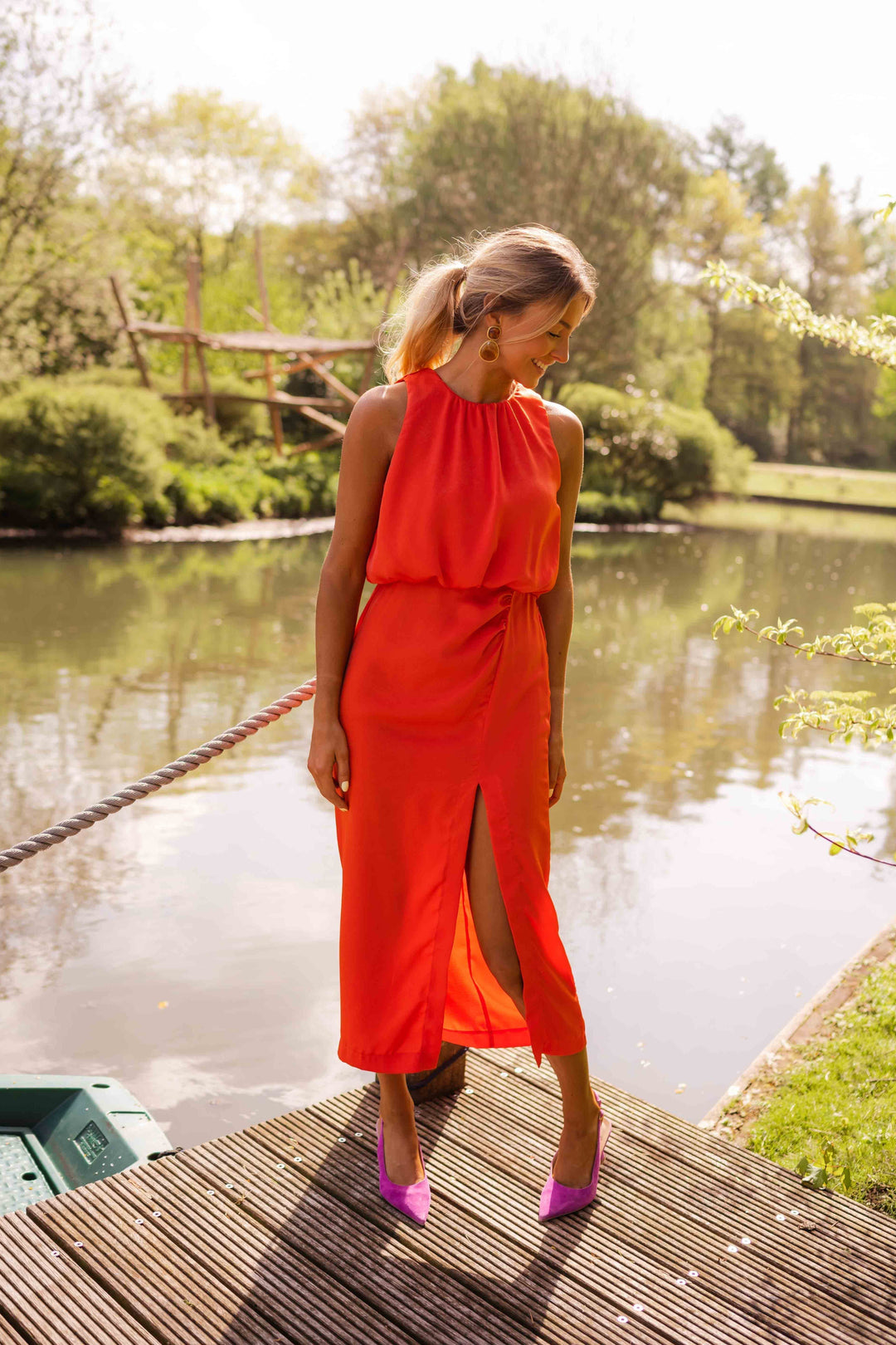 Elegant women's summer halter midi dress with a flattering slit, suitable for any occasion.
