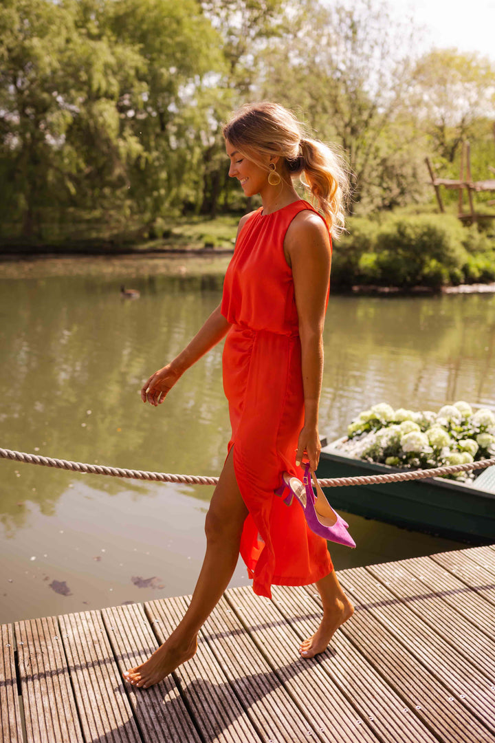 Sleeveless women's halter slit midi dress, ideal for elegant occasions & summer events.