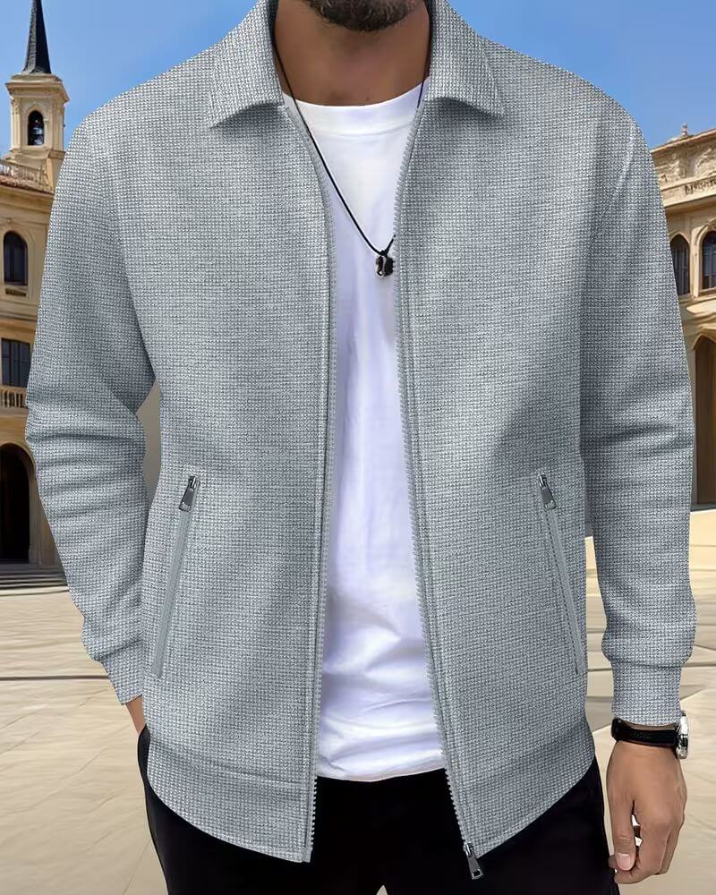 Close-up of men's stylish textured athletic jacket fabric, showing unique pattern & quality.