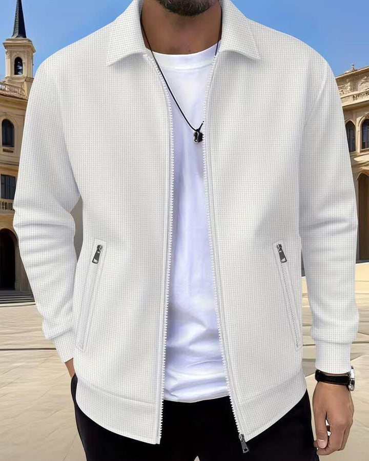 Back view of men's classic athletic jacket, dark color, showcasing fit & streamlined design for sports.