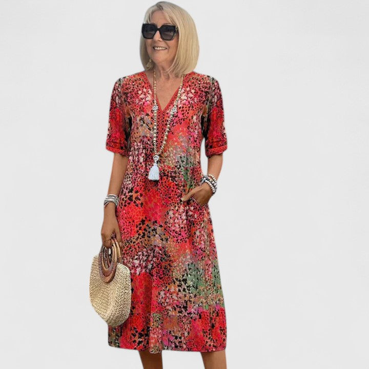 Chic women's elegant flowy midi dress, ideal for summer. A comfortable & stylish occasion dress from day to night.