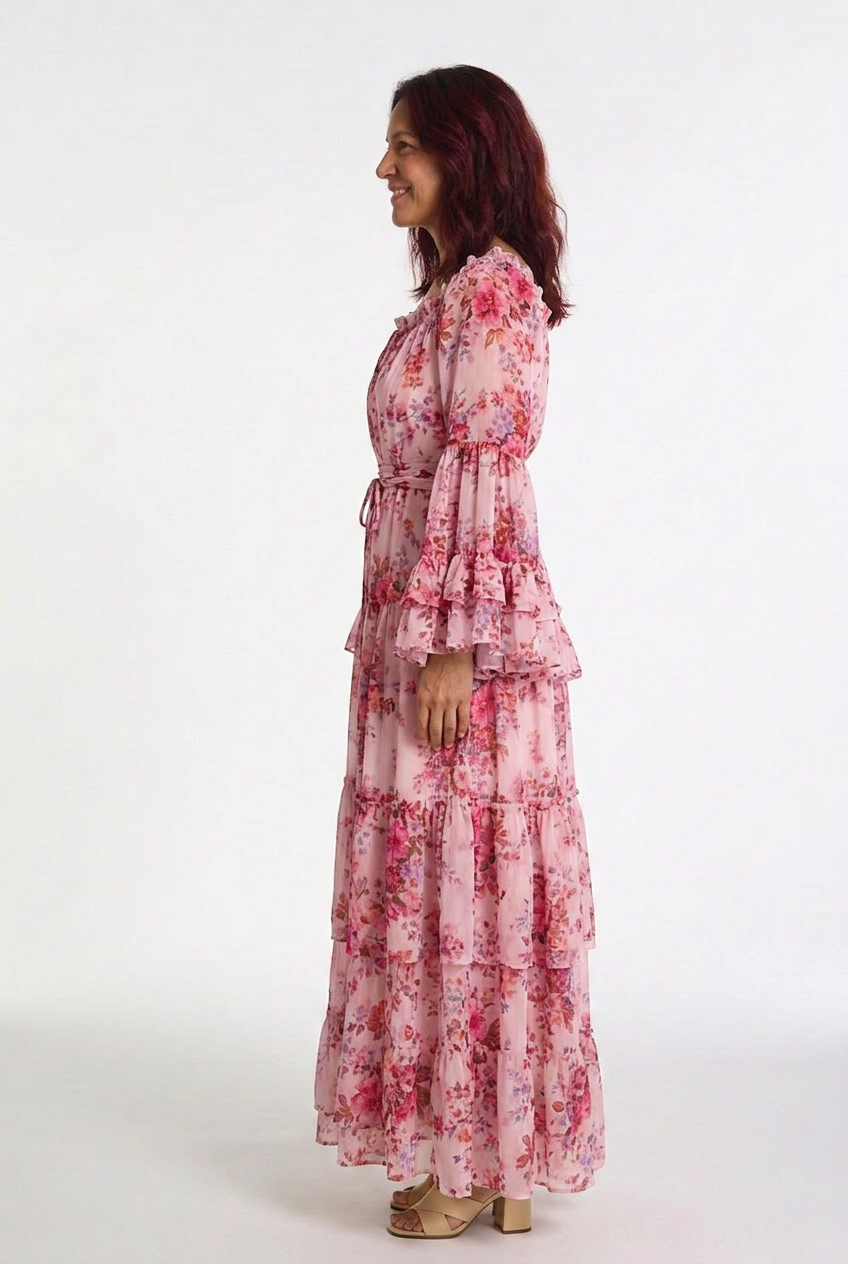 Flowy bohemian floral maxi dress for women, featuring a tie waist & ruffle sleeves, ideal for casual elegant wear.
