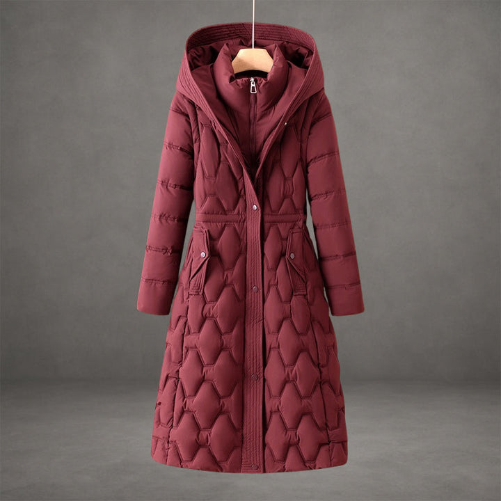 Warm hooded maxi puffer jacket for women, featuring elegant quilting and long design.