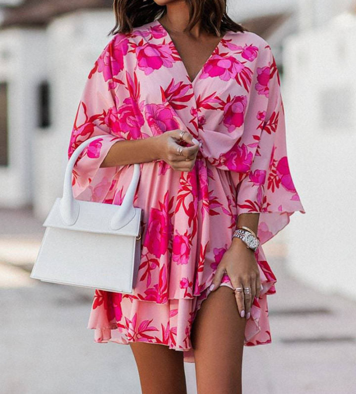 Stylish women's summer mini dress, bohemian floral pattern with ruffles for versatile wear.