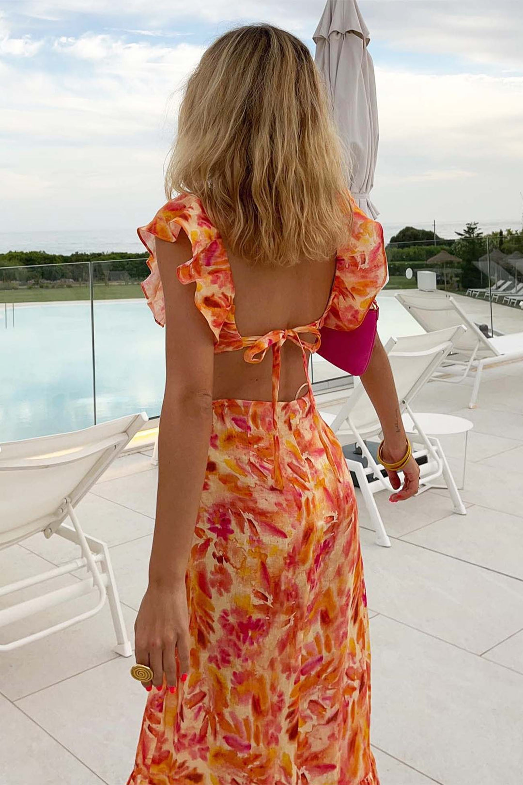 Elegant floral print maxi dress for women, featuring ruffles, V-neck, and short sleeves, ideal for summer.