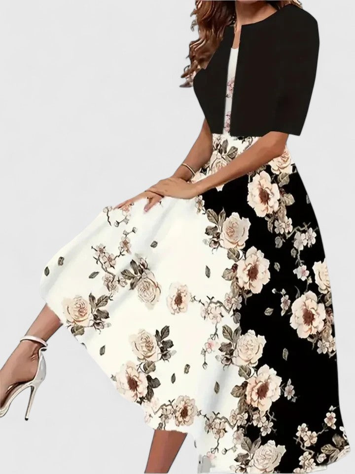 Sophisticated women's midi dress, showcasing elegant fabric and a flattering cut for evening wear.
