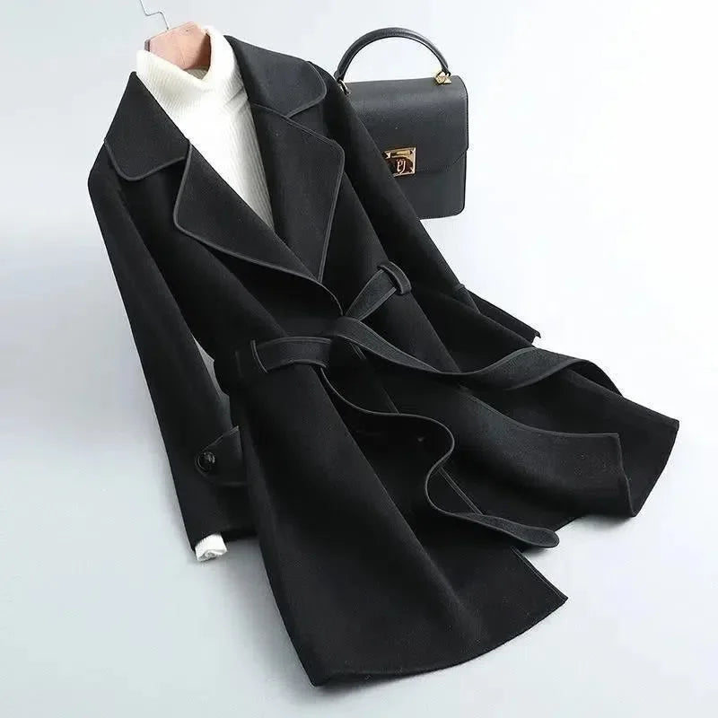 Elegant women's tailored trench coat, longline design, ideal for office wear and casual chic.