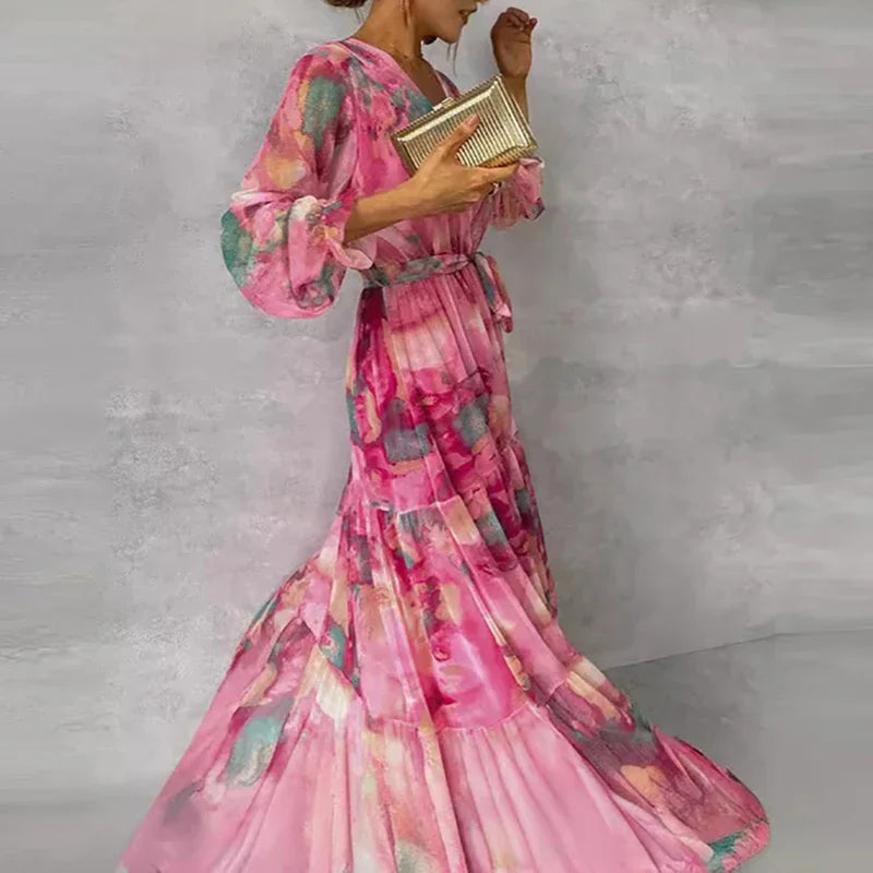 Women's elegant pink floral print midi wrap dress with flattering silhouette, perfect as a wedding guest or summer dress.