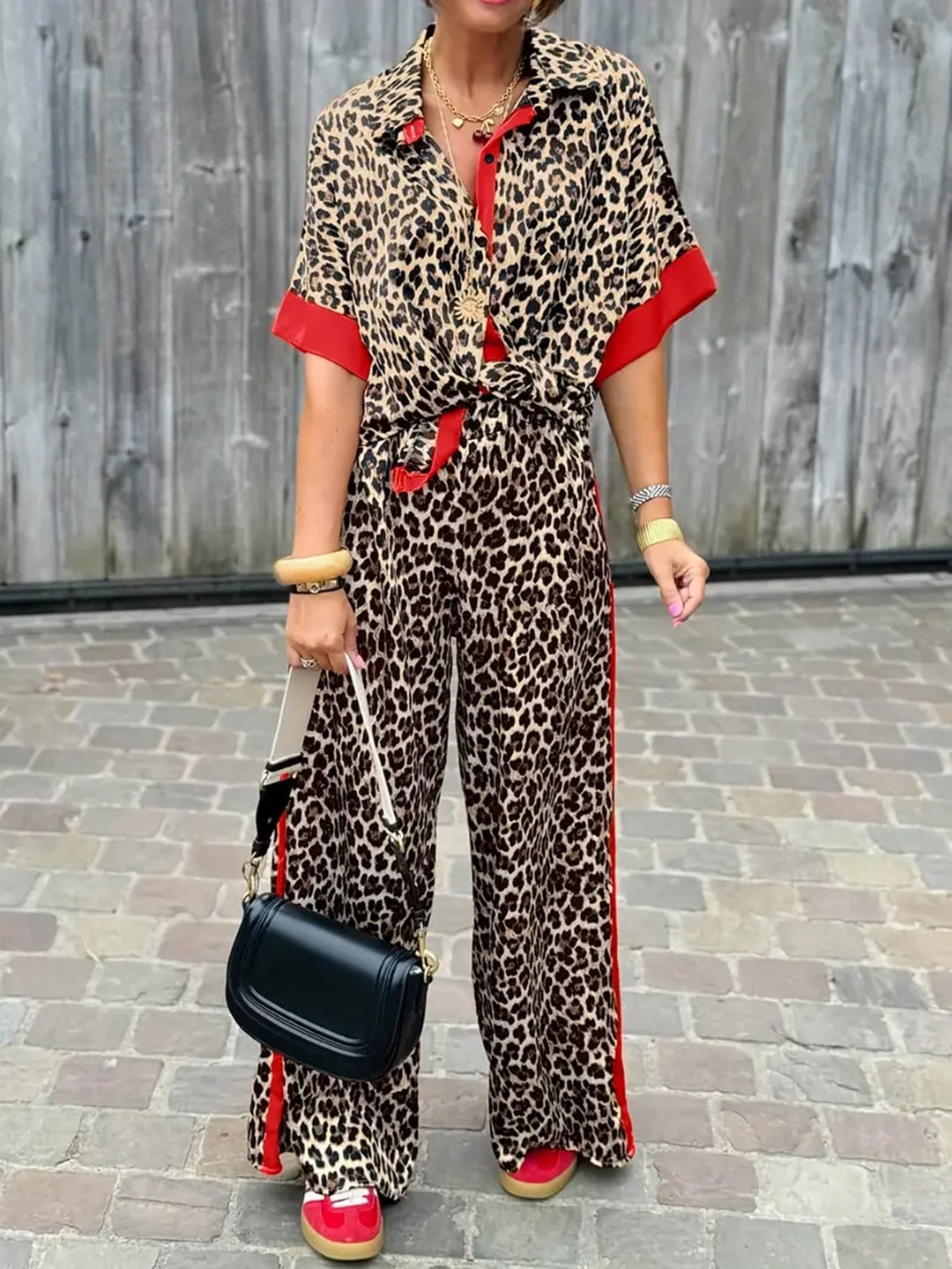 Chic women's two-piece collared top & wide-leg trousers set. Elegant coordinated outfit for spring/summer.