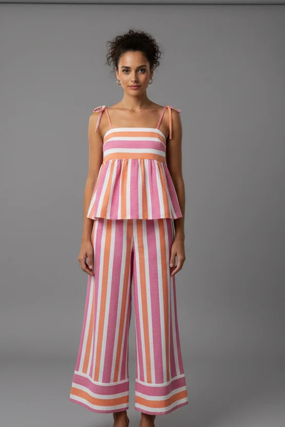 Chic pink printed women's trouser set. Comfortable two-piece summer outfit, ideal for breathable everyday fashion or vacation.