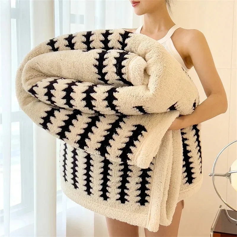 Stylish geometric pattern throw, reversible design, perfect for warm bedroom comfort.