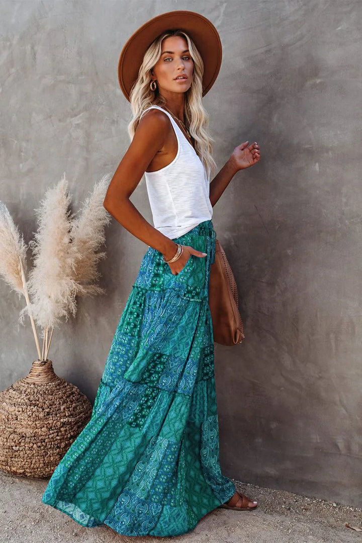 Women's elegant floral high-waisted A-line maxi skirt, a key piece for spring/summer.