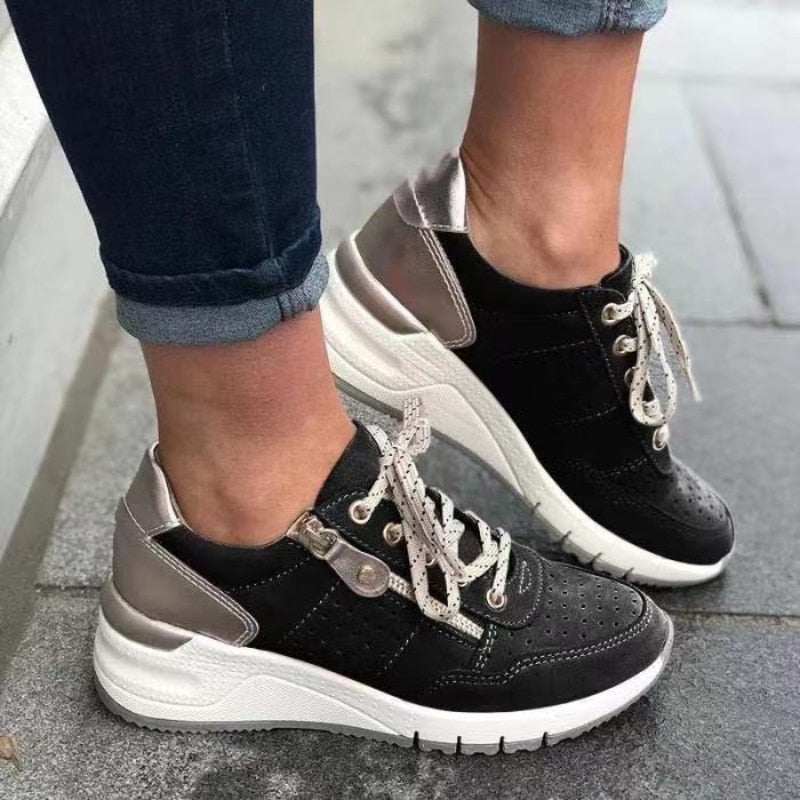 Practical women's walking sneakers with platform wedge, lace-up front, & side zip access.