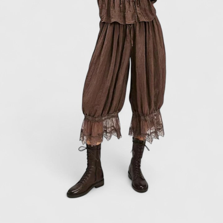 Close-up of the intricate patchwork design on women's stylish mid-rise casual pants.