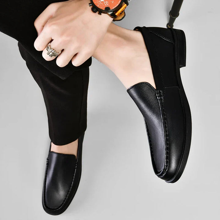 Men's elegant slip-on brown loafers, combining comfort with versatile fashion appeal.