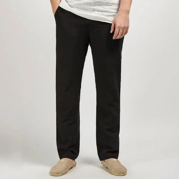 Full-length view of men's straight leg linen trousers, relaxed fit for breathable, warm weather fashion.